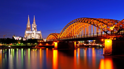 Beautiful night with hohenzollern bridge and cathedral in Cologne, Germany