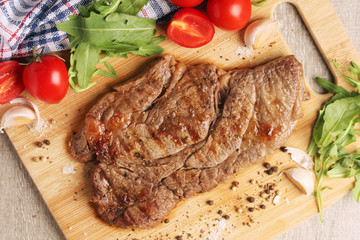 A beef steak well done with vegetables