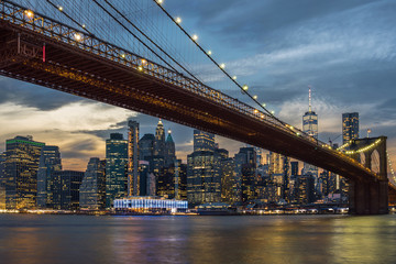 Fototapeta na wymiar Scene of New York City Skyline And Brooklyn Bridge over the easgt river, manhattan, USA downtown skyline, Architecture and building with tourist concept
