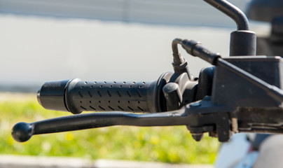 Close up shot of motorcycle brake lever and throttle from top view