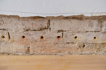 old ruined wall in old flat with preparation for isolation