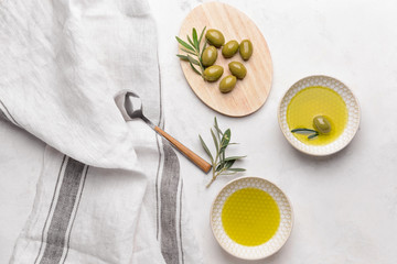 Tasty olive oil on light table