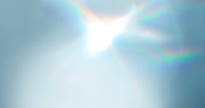 Diamond Rainbow Sparkles. Loop. The light passes through the facets of a slowly rotating diamond and creates repetitive sparkling highlights and rainbow colors