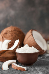 Bowl with coconut oil on table