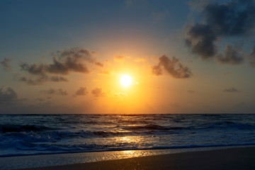 sunrise on the beach with soft wave.