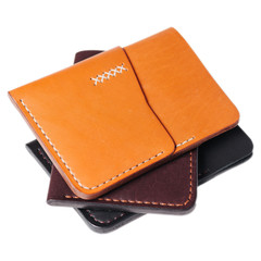 Leather accessories on a white background, wallets, coin boxes and straps, isolated