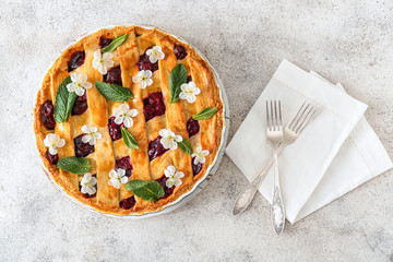 Tasty cherry pie on table