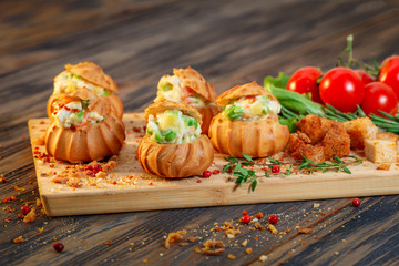profiteroles with vegetable filling and tomatoes
