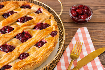Tasty cherry pie on wooden table, closeup