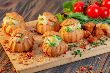 profiteroles with vegetables cheese filling with fresh greens and tomatoes on a plate 