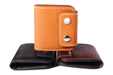 Leather accessories on a white background, wallets, coin boxes and straps, isolated