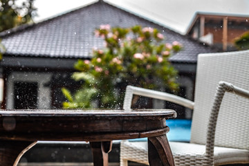 Raintrops splash on a table