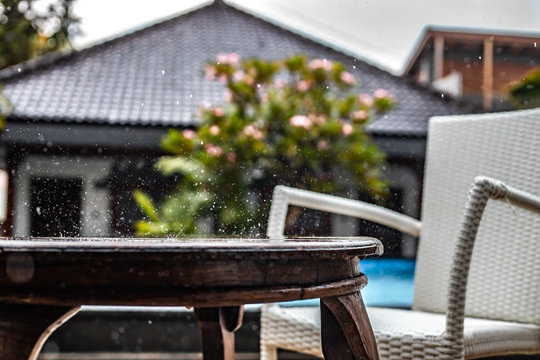 Raintrops splash on a table - Powered by Adobe