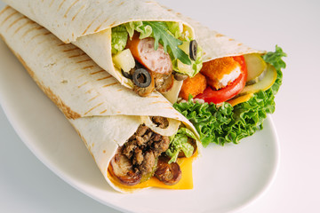 tortilla wraps with meat and vegetables