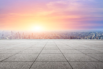 Shanghai city skyline and empty square floor with beautiful clouds scenery at sunset