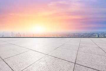Fototapeta premium Shanghai city skyline and empty square floor with beautiful clouds scenery at sunset