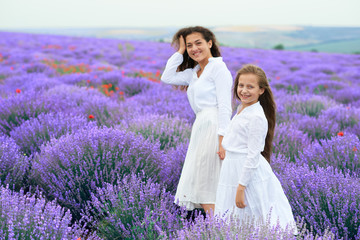 girls are in the lavender flower field, beautiful summer landscape