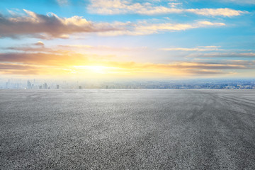 Shanghai city skyline and asphalt race track ground scenery at sunrise