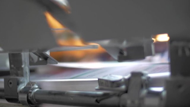 Close up of Print Sheets Offset Printing Press Machine