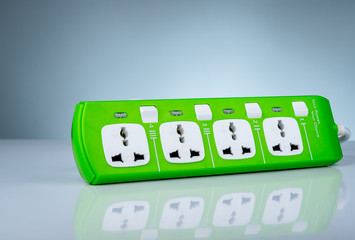 High quality and safety power strip with four electrical standard socket. Green universal plug with overload protection. Fire resistant material for cover. Circuit breaker. Individual switch.