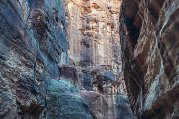Rocky walls of so called Siq passage in ancient Petra city in Jordan
