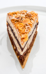 Treugolnic a piece of banana cake on white background