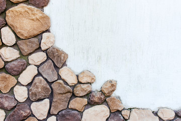 Surface of stone and white plaster.