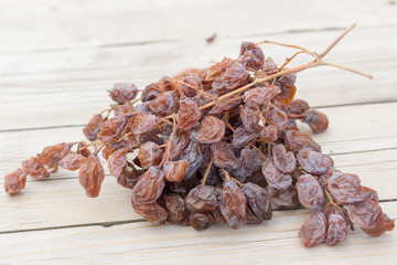 dried grapes on a wooden table
