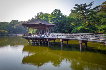Fototapeta na wymiar Ukimido Pavillion on water in Nara park, Japan