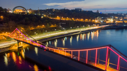 aerial night city view, luminous buildings and bridge.  Drone shot
