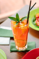 Fresh lemonade with citrus fruits and mint.