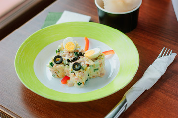 Kid food - potato salad with eggs in a form of butterfly.