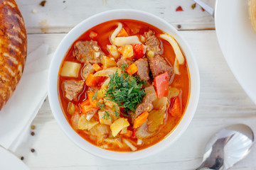 Top view of lagman or laghman uygur dish on white table.