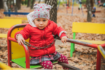 Concept of children life. Lifestyle of child, baby girl at park  