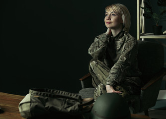 Fototapeta na wymiar Portrait of young female soldier