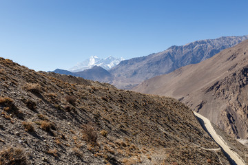 Mountain landscape Nepal, mountain road, Mount Dhaulagiri and Tukuche Peak