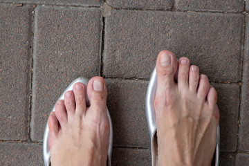 tired female feet without shoes