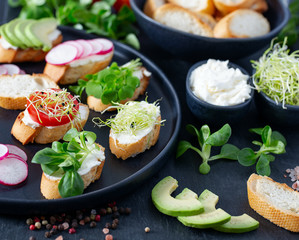 toasted breads of baguette with cream cheese and vegetables