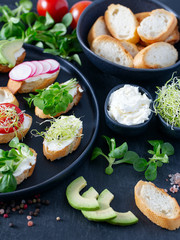 toasted breads of baguette with cream cheese and vegetables