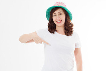 Summer t shirt design and people concept close up of woman in blank template white t-shirt and beach hat point on copy space on white tshirt. Mock up. Front view.