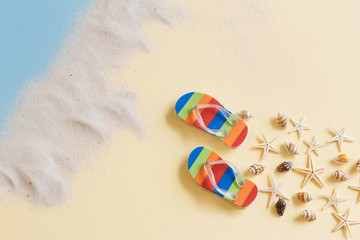 shell flip flops thongs beach sand   top view with copy space for your text. flat lay. 