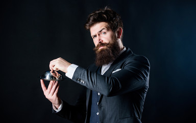 Culinary expert. Waiter man. Perfect recipe. Mature hipster with beard hold food tray in restaurant. brutal caucasian hipster hold metallic dish. Bearded man chef presenting meal. businessman in suit