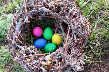 Easter eggs in the nest in the sun