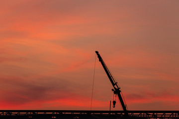 construction site  silhouette on sunset background