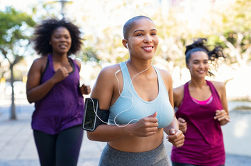 Group of natural curvy women jogging