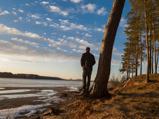 Man at sunset.A man looks at the sunset.