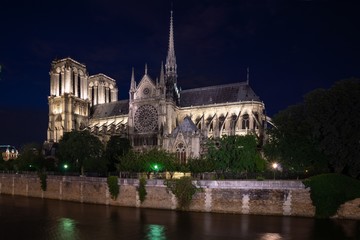 Fototapeta na wymiar Notre Dame Cathedral and River Seine Paris France at Night