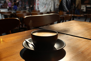 cup of coffee on wooden table