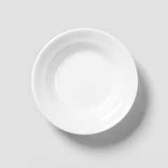 Empty porcelain white plate isolated on white background