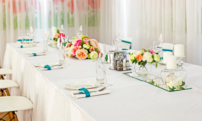 Served tables in restaurants and cafes, meals and drinks on the tables, room design.